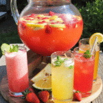 5 Refreshing Summer Punch Recipes served in a glass punch bowl with fruit and mint