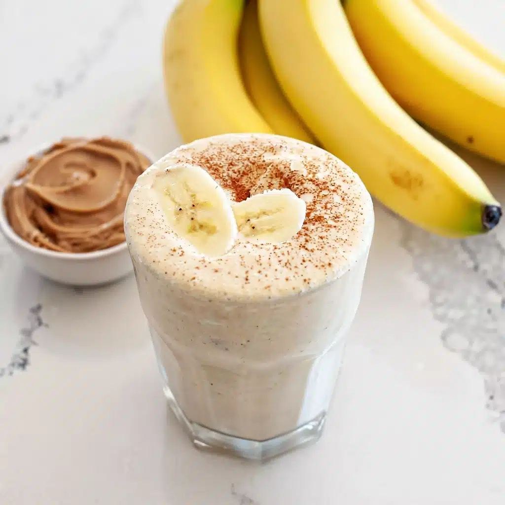 Creamy banana smoothie with peanut butter and cinnamon—an easy, protein-packed breakfast shake idea.