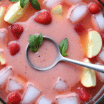 Creamy strawberry apple punch recipe with mint and fruit garnish