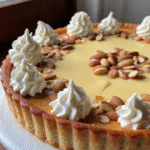 Marzipan tart cheesecake with almonds and whipped cream