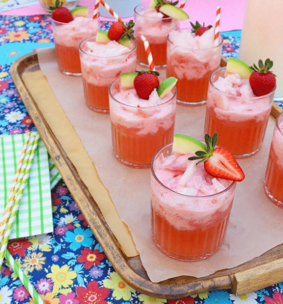 Creamy strawberry apple punch recipe with mint and fruit garnish