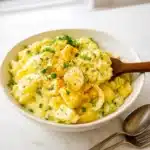 best potato salad recipe in white ceramic bowl on kitchen counter