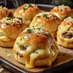 Garlic parmesan cheeseburger bombs recipe stacked with cheese and parsley