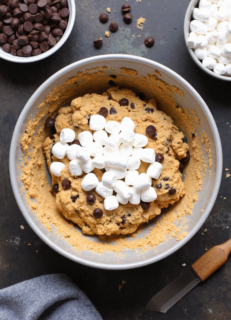 S'mores Cookie Cup dough with marshmallows and chocolate chips ready to bake