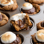 S'mores Cookie Cups fresh from oven with gooey marshmallows and melted chocolate