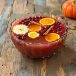 autumn punch mocktail served in punch bowl with apple slices