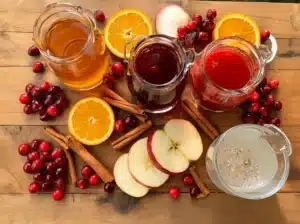 autumn punch mocktail ingredients displayed on wooden table