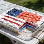 4th of July Jello cake with whipped topping and berry flag design